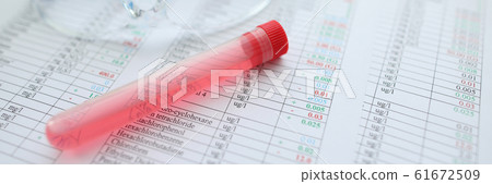 Testing tube with red liquid lying at chemical composition Testing tube with red liquid lying at chemical composition 61672509