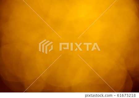 Golden bokeh baubles on dark background. Abstract 61673218