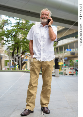 Handsome senior tourist man exploring the city of Bangkok, Thail Handsome senior tourist man exploring the city of Bangkok, Thail 61673881