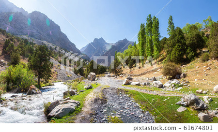 Scenic panorama of sunny day on hiking track Scenic panorama of sunny day on hiking track 61674801