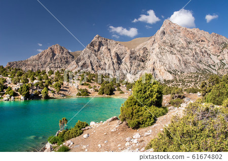 Amazing sunny day in mountains. Descent down from 61674802