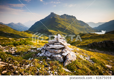Stone cairn with Giglachsee lake behind Stone cairn with Giglachsee lake behind 61675059