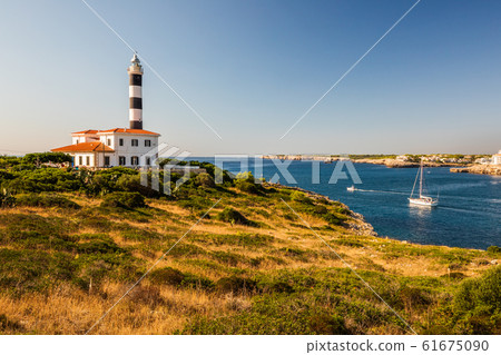 Portocolom lighthouse with boat below, Mallorca Portocolom lighthouse with boat below, Mallorca 61675090