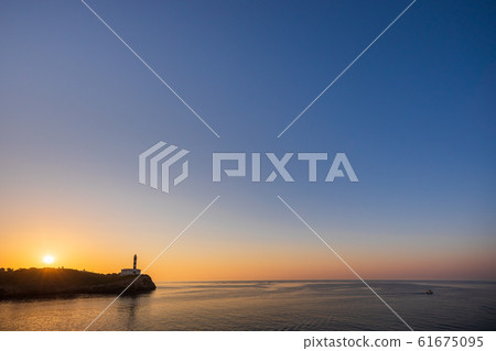 Portocolom lighthouse with sunrise, copy space Portocolom lighthouse with sunrise, copy space 61675095