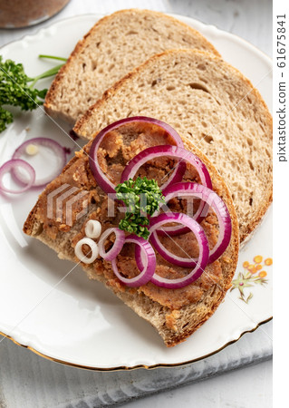 Bread slathered with pork lard mixed with ground cracklings 61675841