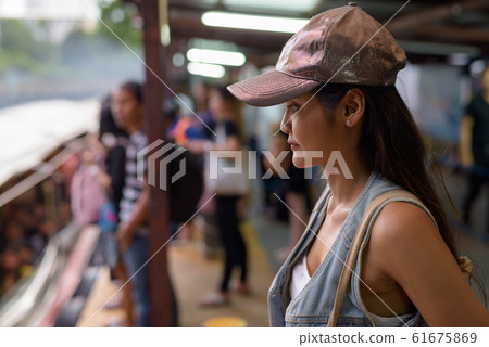 Young beautiful Asian tourist woman exploring the city of Bangko Young beautiful Asian tourist woman exploring the city of Bangko 61675869