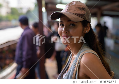 Young beautiful Asian tourist woman exploring the city of Bangko Young beautiful Asian tourist woman exploring the city of Bangko 61675871