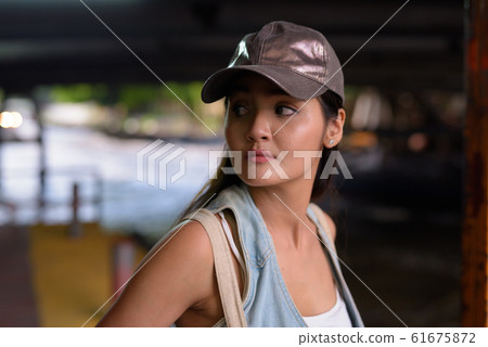 Young beautiful Asian tourist woman exploring the city of Bangko Young beautiful Asian tourist woman exploring the city of Bangko 61675872