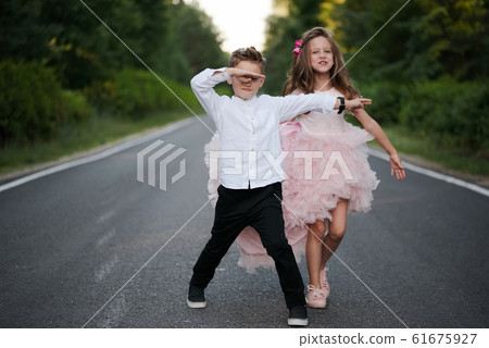 young happy boy and girl together outside 61675927