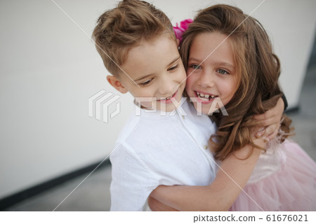 young happy boy and girl together outside 61676021