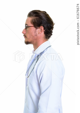 Profile view of young handsome man doctor with eyeglasses isolat Profile view of young handsome man doctor with eyeglasses isolat 61676674