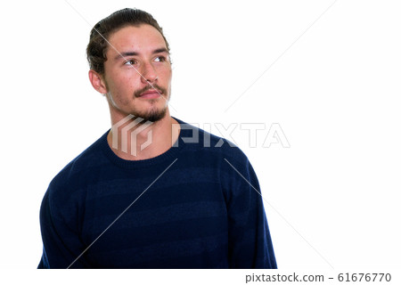Close up of young handsome man thinking isolated against white b 61676770