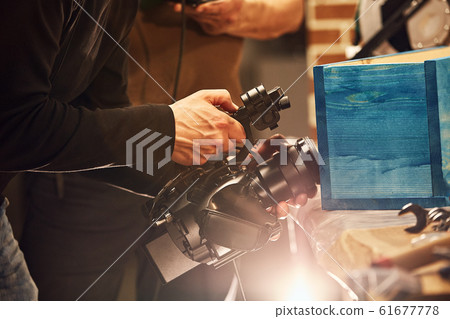 Behind the scenes of video production or video shooting, Film grain, selective focus, special illumination Behind the scenes of video production or video shooting, Film grain, selective focus, special illumination 61677778