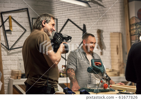 Behind the scenes of video production or video shooting, Film grain, selective focus, special illumination Behind the scenes of video production or video shooting, Film grain, selective focus, special illumination 61677826