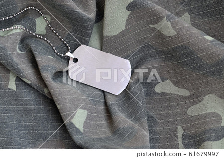 Silvery military beads with dog tag on camouflage Silvery military beads with dog tag on camouflage 61679997
