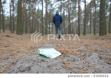 Young man loses his euro money bills on Russian Young man loses his euro money bills on Russian 61680018