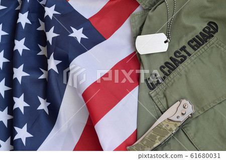 Military dog tag token and knife lies on Old US Military dog tag token and knife lies on Old US 61680031