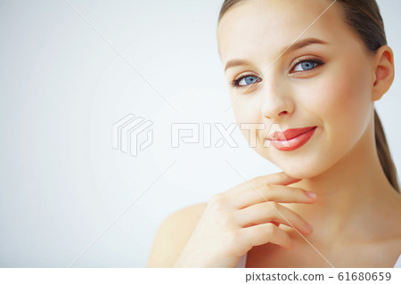 Beauty and Care. A Woman With Pure Skin Hold A Face Cream. Morni Beauty and Care. A Woman With Pure Skin Hold A Face Cream. Morni 61680659