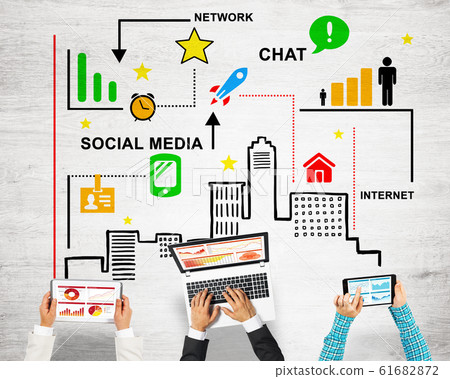 Top view of businesspeople sitting at table and using gadgets Top view of businesspeople sitting at table and using gadgets 61682872