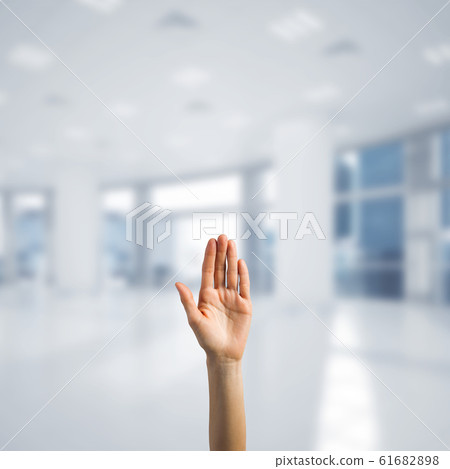 Choosing gesture of person in elegant modern interior in sunshine light Choosing gesture of person in elegant modern interior in sunshine light 61682898