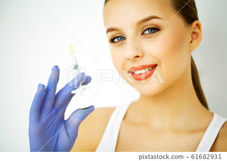 Beauty and Care. Portrait of a Young Woman with a Beautiful Skin. Cosmetology. Woman with Beautiful Blue Eyes. Injection Cosmetology. Youth Injection 61682931