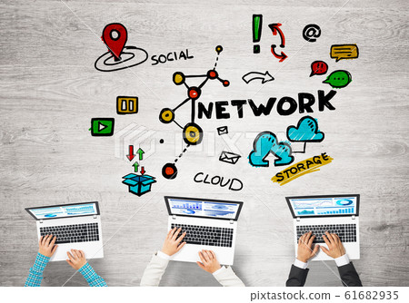 Top view of businesspeople sitting at table and using gadgets Top view of businesspeople sitting at table and using gadgets 61682935