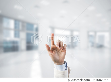 Choosing gesture of businessperson in elegant modern interior in Choosing gesture of businessperson in elegant modern interior in 61682936