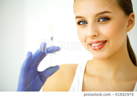 Beauty and Care. Portrait of a Young Woman with a Beautiful Skin. Cosmetology. Woman with Beautiful Blue Eyes. Injection Cosmetology. Youth Injection 61682978