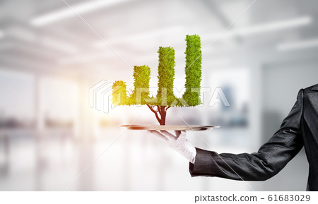 Hand of waitress presenting growing graph on tray. Hand of waitress presenting growing graph on tray. 61683029