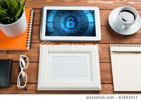 Web security and technology concept with tablet pc on wooden table 61683033