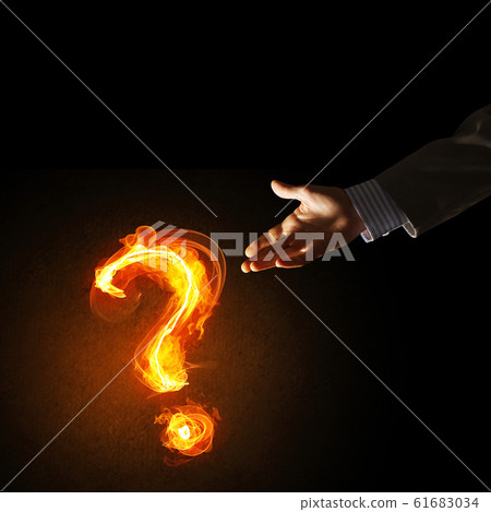 Concept of help or support with fire burning question mark 61683034