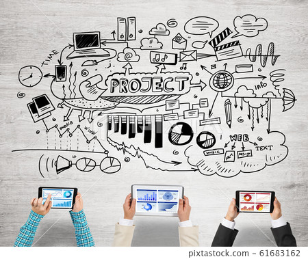 Top view of businesspeople sitting at table and using gadgets Top view of businesspeople sitting at table and using gadgets 61683162