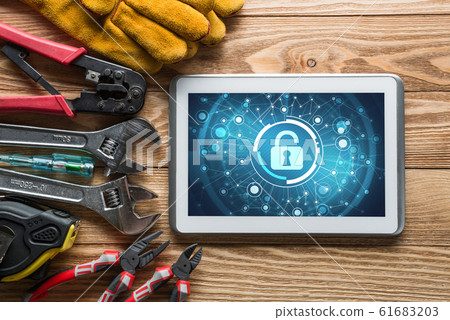Web security and technology concept with tablet pc on wooden table Web security and technology concept with tablet pc on wooden table 61683203