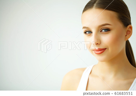 Beauty and Care. Portrait of a Young Woman with a Beautiful Skin. Woman with Beautiful Blue Eyes. Cosmetics. Skin Care Beauty and Care. Portrait of a Young Woman with a Beautiful Skin. Woman with Beautiful Blue Eyes. Cosmetics. Skin Care 61683551