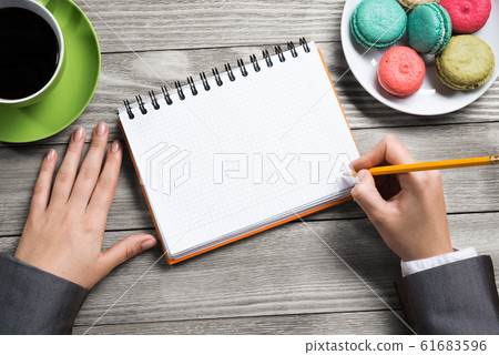 Businesswoman making some notes Businesswoman making some notes 61683596