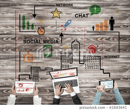 Top view of businesspeople sitting at table and using gadgets Top view of businesspeople sitting at table and using gadgets 61683641