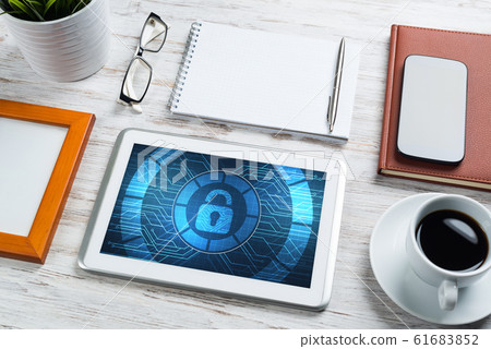 Web security and technology concept with tablet pc on wooden table 61683852
