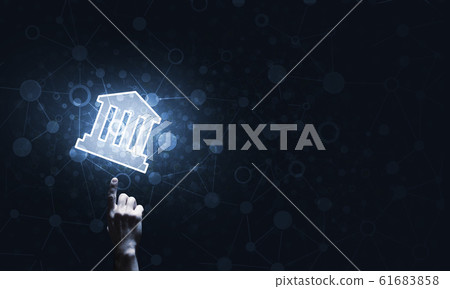 Conceptual image with hand pointing at house or main page icon on dark background 61683858