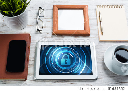 Web security and technology concept with tablet pc on wooden table Web security and technology concept with tablet pc on wooden table 61683862