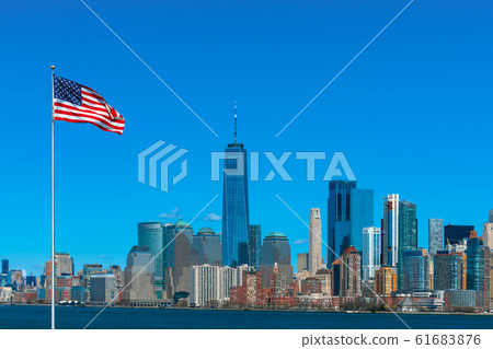 Scene of Flag of America over New york cityscape river side which location is lower manhattan,Architecture and building with tourist and Independence day concept Scene of Flag of America over New york cityscape river side which location is lower manhattan,Architecture and building with tourist and Independence day concept 61683876