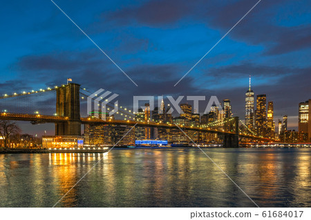 scene of New york Cityscape with Brooklyn Bridge over the east river at the twilight time, USA downtown skyline, Architecture and transportation concept 61684017