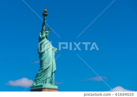 The Statue of Liberty under the blue sky background, Lower Manhattan, New York City, Architecture and building with tourist concept 61684020