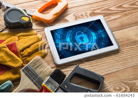 Web security and technology concept with tablet pc on wooden table Web security and technology concept with tablet pc on wooden table 61684243