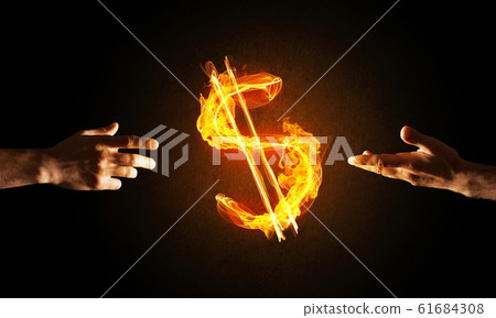 Concept of money making with dollar currency fire symbol on dark background Concept of money making with dollar currency fire symbol on dark background 61684308