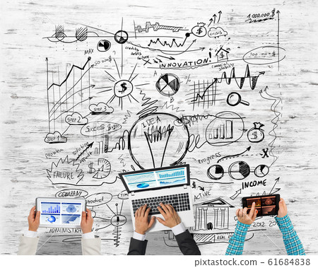 Top view of businesspeople sitting at table and using gadgets Top view of businesspeople sitting at table and using gadgets 61684838