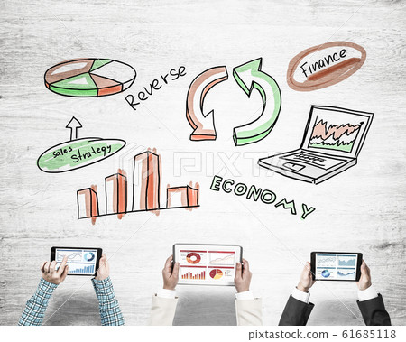Top view of businesspeople sitting at table and using gadgets 61685118
