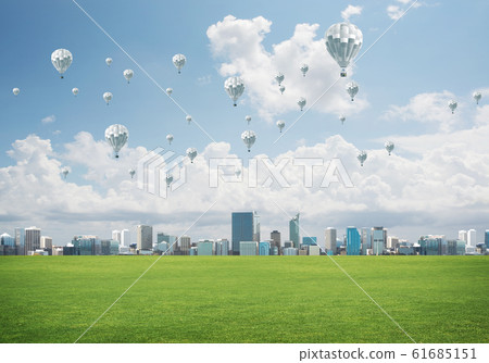 Concept of eco green life with aerostats flying above city Concept of eco green life with aerostats flying above city 61685151