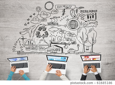 Top view of businesspeople sitting at table and using gadgets Top view of businesspeople sitting at table and using gadgets 61685186