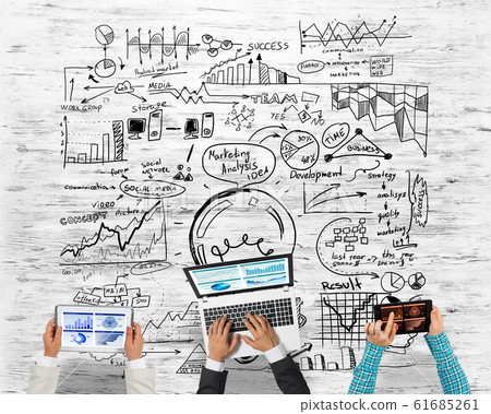 Top view of businesspeople sitting at table and using gadgets Top view of businesspeople sitting at table and using gadgets 61685261