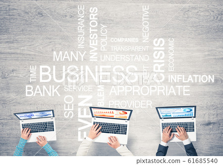 Top view of businesspeople sitting at table and using gadgets 61685540